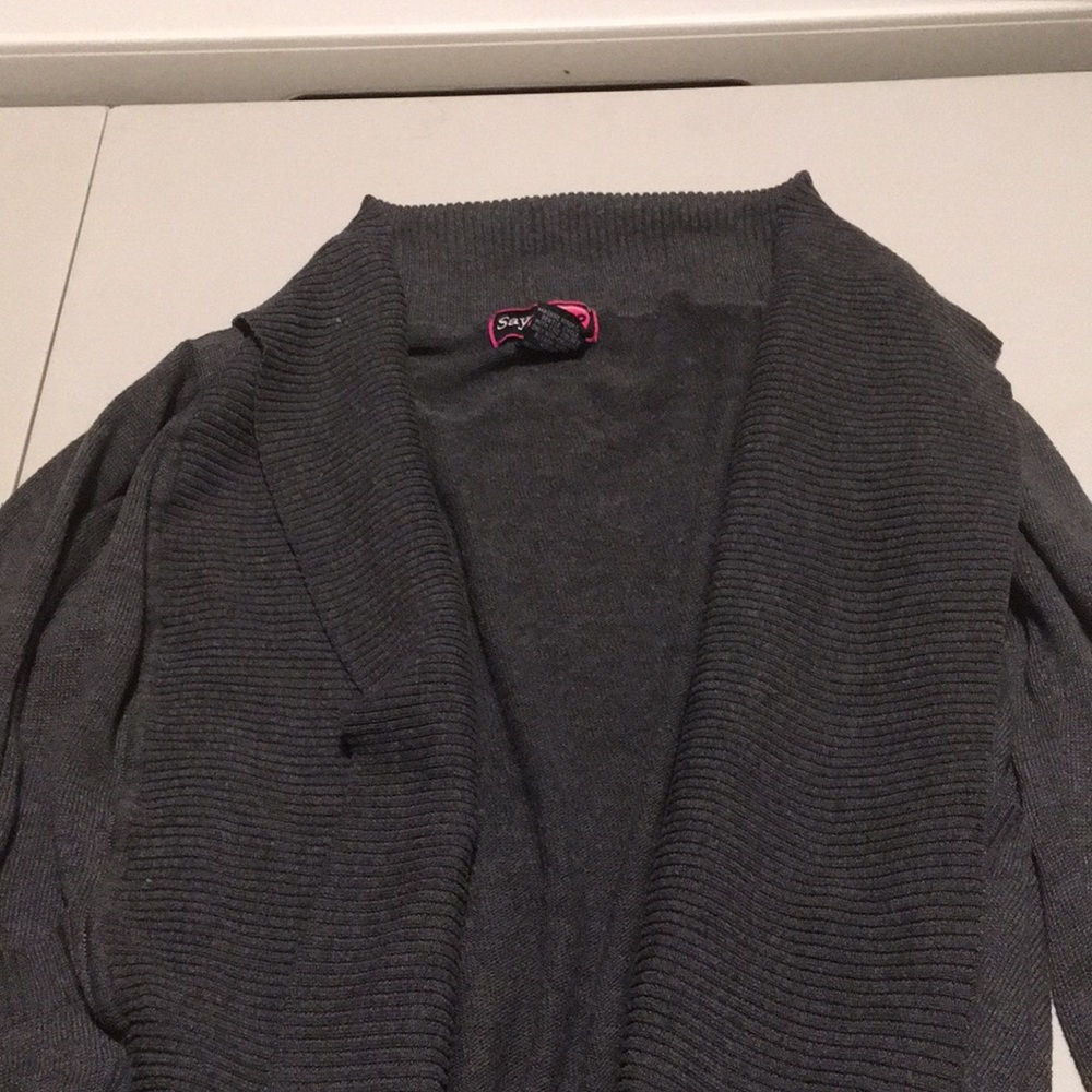 Woman’s long-sleeved open sweater